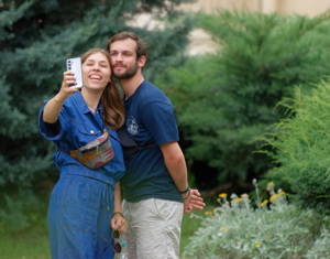 Young couple posing a selfie in a garden
